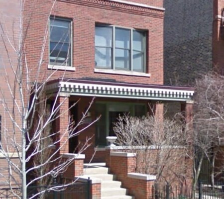 634 W. Aldine Avenue, c.1910, Lake View. A two-story red brick residence with a bracketed and dentiled porch cornice, brick porch piers and a raised entry. Demolished August 2026. Photo credit: Google Maps
