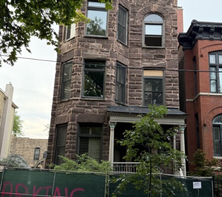 909 W. Webster Avenue, c.1888, Lincoln Park. A three-story rusticated brownstone with raised English basement, arched third-floor window and a wood entry porch with turned columns. Demolished August 2026. Photo credit: Peter Fynmere