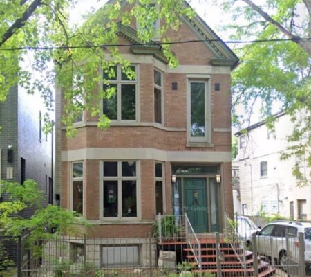 2121 W. Cortland Street, c.1890, Bucktown. A brick residence with a steep front gable and decorative bargeboard, two-story canted bay and contrasting stone banding. Demolished August 2026. Photo credit: Google Maps