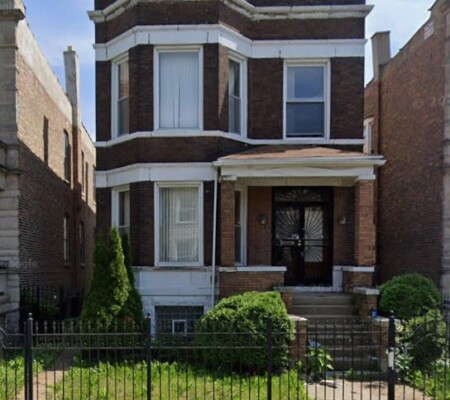 4143 W. 21st Street, c.1900, North Lawndale. A two-story brick two-flat with a projecting three-sided bay, pressed metal cornice and pedimented parapet. City-owned. Emergency demolition, August 2026. Photo credit: Google Maps